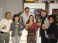 Melissa van Aswegen (third from left, front row) and Ncami Sithole (right) of Rainbow during their tour of the Stella Artois stand.