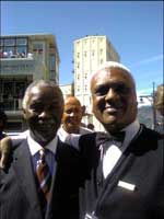 President Thabo Mbeki (left) with Gham Gourmet waiter Arnold Abrahams.