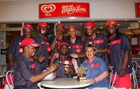 Lorraine Schuit, Ola Milky Lane Pavilion franchisee, celebrates the team’s South African Council of Shopping Centres’ Special Star Award for excellent customer service with her management team.