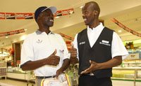 Deaf staff member Vincent Masilo assisting shopper Gidion Tsindi at Checkers Hyper at Centurion.