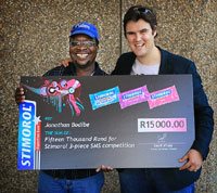 Winner Jonathan > Bodibe, from Heilbron in the Free State, with Doug Place, brand manager for Cadbury SA.