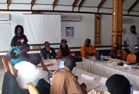 Terna Gyuse (left), IPS Africa regional Editor introducing guest speaker Mohamed Beavogui, IFAD Director for West and Central Africa region, to participants at the media training workshop.