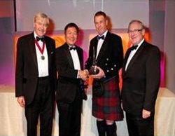 Sir Ian Good (IWSC 2009 President) and Hiroshi Miyamori (Suntory) present Chivas Brothers’ Alan Winchester (The Glenlivet Master Distiller) and Desmond Payne (Beefeater Master Distiller) with the Distiller of the Year award.