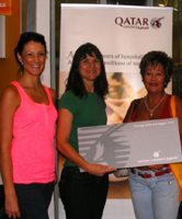 Winner Cindy Robins (right) with Megan from Qatar Airways and Tami of Boost.