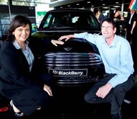Channel MD for Research In Motion (RIM) Ulanova Visser, with the winner of the Midnight Black BlackBerry MINI Cooper, Jan Piorek.
