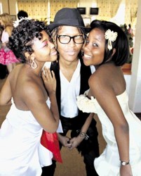 Student designer Aobakwe Ndlosiwa (centre) is flanked by his models Nomvelo Gwala and Anele Mpunzana at the regional judging of the Vodacom Durban Young Designer Awards at Greyville Racecourse.<p>Image courtesy of The Sowetan