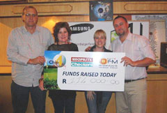A whopping R114 000 was raised at this year’s Shoprite Checkers OFM Chip for Charity. Here Mr. Gary Stroebel from OFM and Mr. Jaco de Swardt from Shoprite Checkers handover the cheque to Ms. Rietha Wagenaar from Child Welfare Bloemfontein & Childline Free State and Ms. Michelle Gertz from the Smile Foundation.