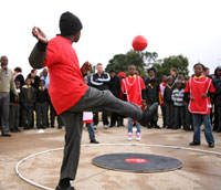 Shomang Primary School children demonstrate soccer with the new Kommunity Sport in a Box game