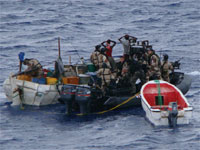 Suspected Somali pirates are apprehended by a patrol of the European Union Naval Force Somalia (EUNAVFOR), one of several initiatives to combat piracy against international shipping off the coast of Somalia. Source: EUNAVFOR