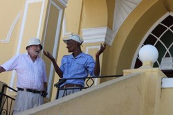 Cyril Johnson shows Londoner Edward Mendelsohn a mosque gifted by the British.