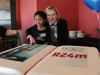 Media24 CEO Esmaré Weideman and the “mascot” for the project, William Swarts (4) of Grabouw. William appears in all the marketing material for the project. Photo by: Leánne Stander