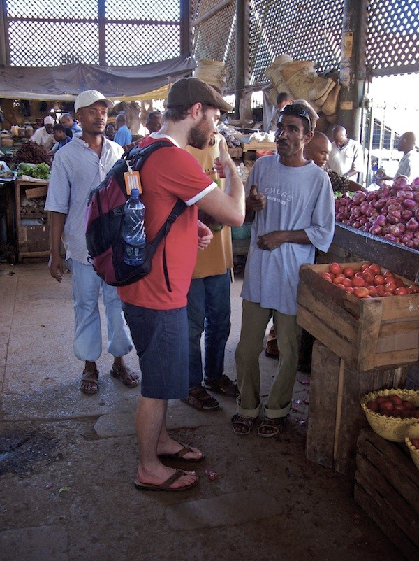Maunder talks to traders at the spice market in Old Town, Mombasa