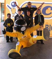 BIC mascot 'BIC Boy' and brand ambassador hand-over prizes to learners.