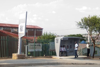Commuters in Alexandra using the shelter