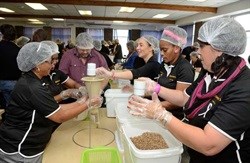 Scooping the ingredients for Team Number Crunchers. (L-R) Fazlin Loonat (left front). Klululwa Bloko, Colin Fish, Claudina Ah-Chong, Noluvuyo Kata and Susan van Hansen