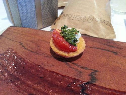 Parmesan cup filled with mozzarella, slow roast tomato and basil pesto