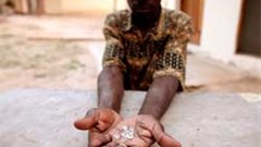 An illegal diamond dealer in Zimbabwe holds gems from Marange mine. Zimbabwe has stopped illegal mining and is now selling its diamonds in Antwerp. Image: