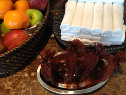 The gym supplies hygienically sealed earphones and neatly rolled sweat towels.