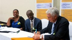 Professor Stuart Whittaker, CEO of COHSASA, signs a Memorandum of Agreement with Boitekanelo College in Botswana as (from left), Dr Khumo Seipone, Director of Health Services in the Ministry of Health and Dr Tiro Mampane, Managing Director of Boitekanelo College look on.
