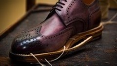 KAP sells footwear interests