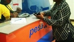 A customer at a PesaPoint Agent Network outlet.