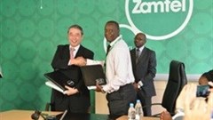 Dr Nobuhiro Endo, President at NEC Corporation, and Dr Mupanga Mwanakatwe, Chief Executive Officer at Zamtel, during the signing ceremony.