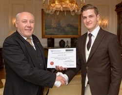 Sean Deveron awards Evert Calitz with his certificate