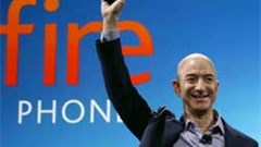 Amazon's Jeff Bezos holds up the company's Fire smartphone but sales have failed to produce sustainable profits for the company. Image: