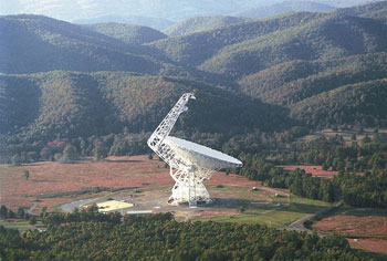 The Robert C. Byrd Green Bank Radio Telescope (GBT) focuses 2.3 acres of radio light. It is 150m tall, nearly as tall as the nearby mountains and much taller than pine trees in the national forest. The telescope is in a valley of the Allegheny Mountains to shield the observations from radio interference. (Image: NRAO/AUI)