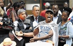 WE WANT THE MONEY! Wits University Vice-Chancellor Adam Habib, middle, watches as the Student Representative Council protests the university's demand that poor students pay a registration fee of R4,670.<p>Photographer: Alon Skuy