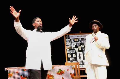Atandwa Kani (left) and Mncedisi Shabangu in Syracuse Stage’s Sizwe Banzi is Dead. Photo by Ruphin Coudyzer