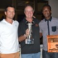 Winners Blair Taberer (left) and Munya Mudyanadzo (right) being presented with their trophy by AAT group chairman Dave Glynn(middle)