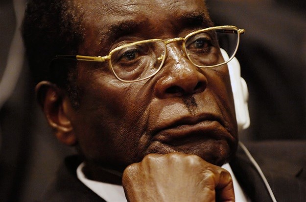 Robert Mugabe by Tech. Sgt. Jeremy Lock (USAF) - dodmedia.osd.mil. Licensed under Public Domain via