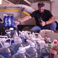 John Kieser with water bottles earmarked for distribution.