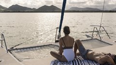 Sunbathing on catamaran A