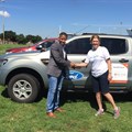 Ensly Dooms from Ford South Africa and Paula Barnard from World Vision SA at the official handover of the Ford Rangers in Soweto, Johannesburg.