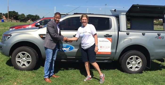 Ensly Dooms from Ford South Africa and Paula Barnard from World Vision SA at the official handover of the Ford Rangers in Soweto, Johannesburg.