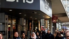 Pedestrians walk past the entrance to a BHS store on Oxford Street in central London on 25 April 2016.