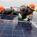 Installing solar panels on Emperors Palace rooftop