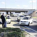 Source:  - Police block metered taxi drivers from protesting against Uber cab drivers outside Cape Town airport. Picture: Michael Walker/INLSA