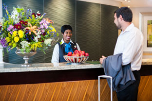 A receptionist checking in a guest at the three-star City Lodge Hotel Lynnwood, one of the hotels that has received at TripAdvisor Certificate of Excellence for 2016.