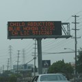 Amber Alert sign: Another example of the use of DOOH to locate missing/abducted children. Image ©  from Honolulu, Hawaii - ,
