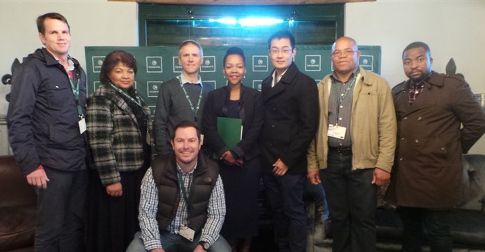 L-R: Petrus Bosman, MD: Bosman Adama and Family Vineyards; Rita Andreas, chairperson: Adama Workers Trust; Phillip Marais, CEO: LaunchLab, Nikiwe Bikitsha, Paul Kim, CEO: Picsa; John Hardnek, farmworker representative and Ambani Ramaru, assistant director: DTI incubation support programme.<p>Front: Chris Wood, executive head: merging payments, strategy and regulatory at Nedbank.
