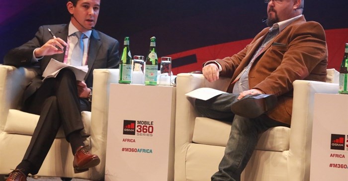 Tigo Tanzania General Manager, Diego Gutierrez (left), at the Global System Mobile Association (GSMA) Mobile 360-Africa Conference, Tanzania; with discussion moderator, Bradley Shaw, founder, Continuum Consulting. Credit: Tigo.