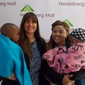 Juanita van Zyl, owner of Shalom Orphanage, Patricia Sefuthi, Heidelberg Mall marketing officer, and children from Shalom Orphanage.