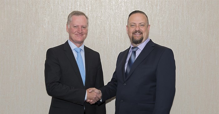 Frans Pienaar (chairman, Inyatsi Construction Group Holdings) and Tommy Strydom (group operations director, Inyatsi Construction) shaking hands to new growth.