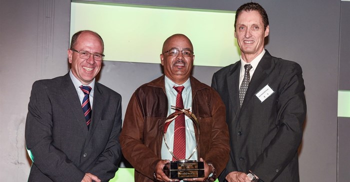 New Harvest Of the Year winner, Andre Cloete with (on left) Casper Kruger, VP of vehicle sales and dealer network for Toyota SA and (on right) Prof Carlu van der Westhuizen