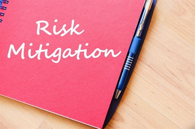 Whose responsibility is risk mitigation for travelling employees?