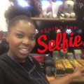 Mokoena in the Goodbye Malaria store at OR Tambo airport, which features Shweshwe pyjama pants, hats and bowties as well as handmade teddies, bracelets and more...