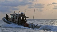 Official Navy Page via  - A Cameroonian Rapid Intervention Battalion (BIR) boat patrols the Cameroon coastal waters.